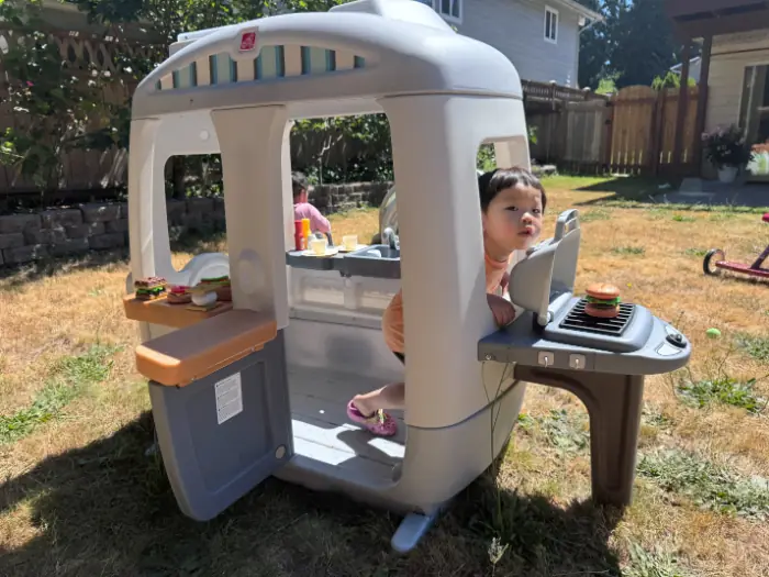 Toddler exploring nature with parent for early learning engagement.