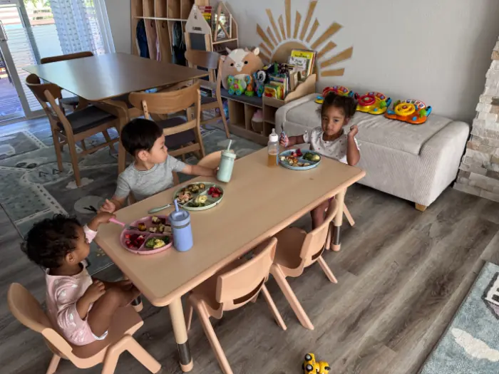 Safe daycare space with secured furniture and toys for infants and toddlers.
