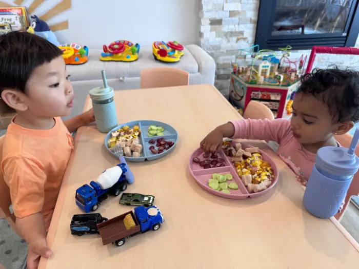  Daycare room with multicultural books and diverse decorations.

