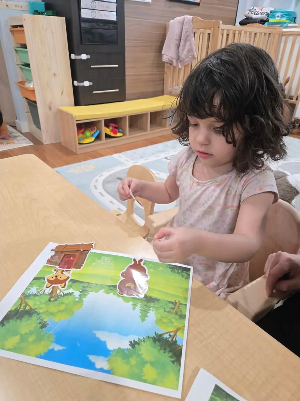 Child happily following a structured daycare routine
