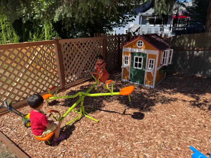 Children participating in group play during child care activities guided by trained daycare staff