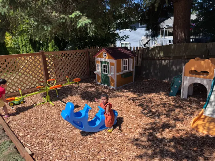 Childcare staff facilitating fun group play for children in a Bothell daycare setting