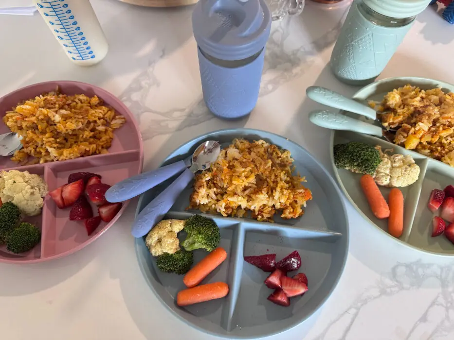 Colorful daycare meal plate with fruits and grains – “Balanced daycare meal with fruits, grains, and proteins for young children.”