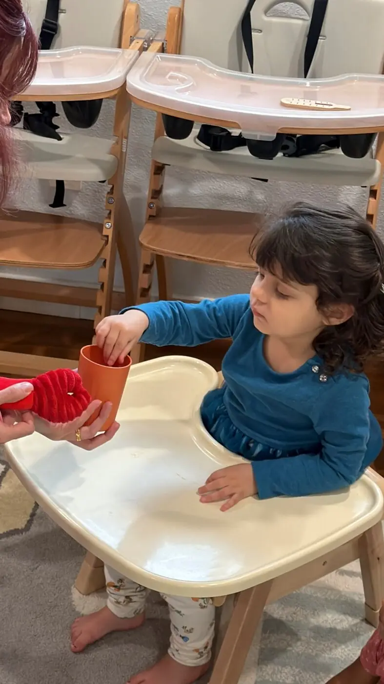 Children follow structured classroom routine calmly