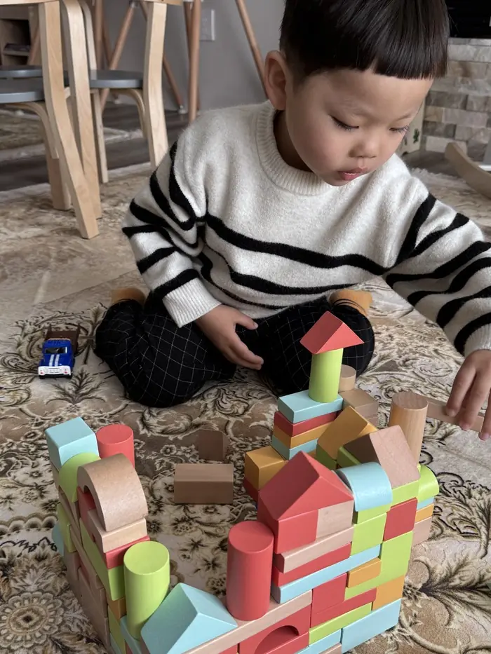 A cozy, well-lit daycare Bothell space with sensory toys for infant engagement.