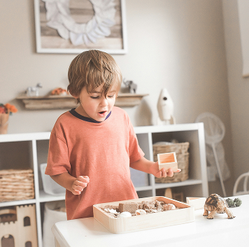 Preschooler doing sensory play at licensed home daycare