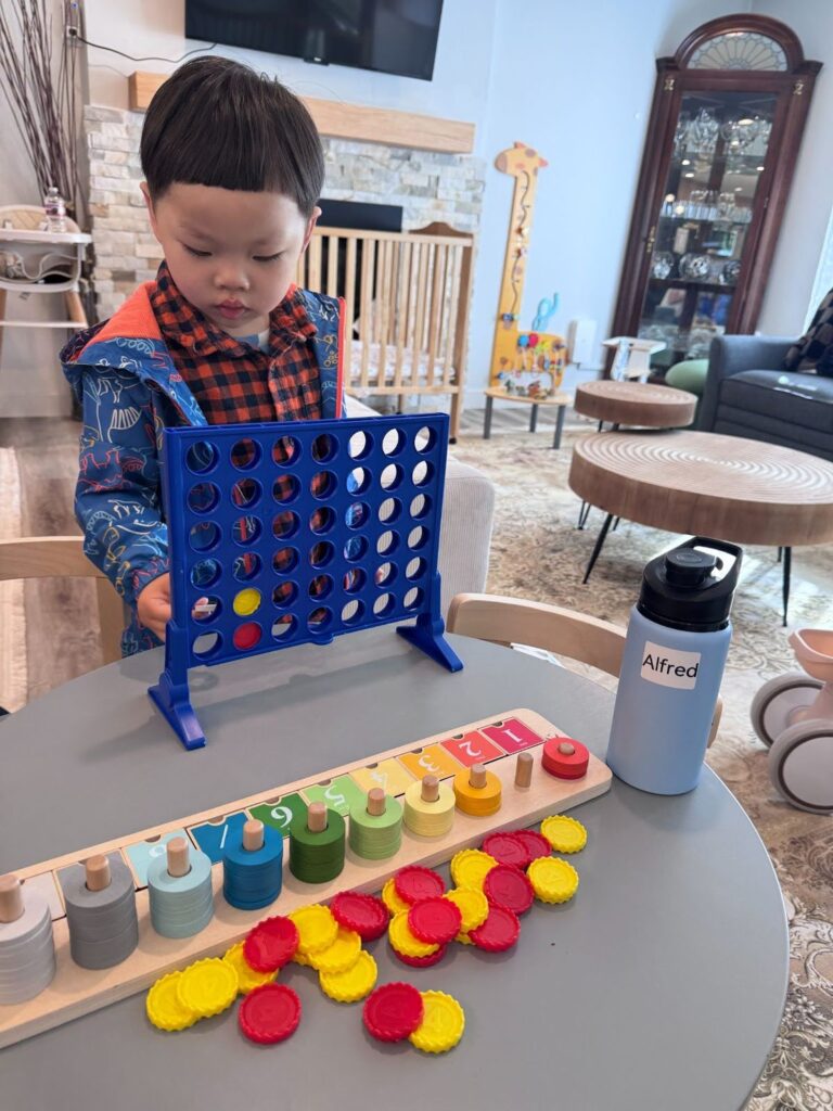 Preschoolers building towers during STEM play at Kido Heaven Child Care in Bothell, WA.