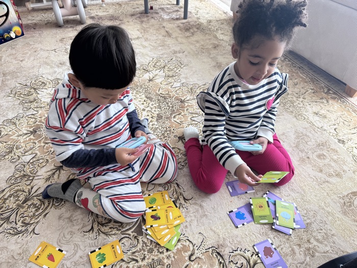 Happy children playing together in a daycare setting, fostering social skills in daycare.



