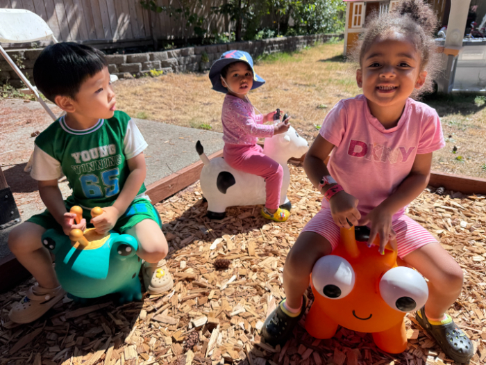 Young children enjoying playtime in a daycare equipped for emergency safety.