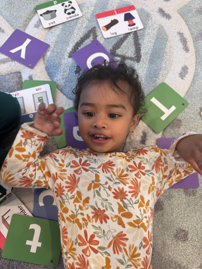 Preschoolers listening to calming story in circle time – Preschooler calming activities during storytime in daycare  
