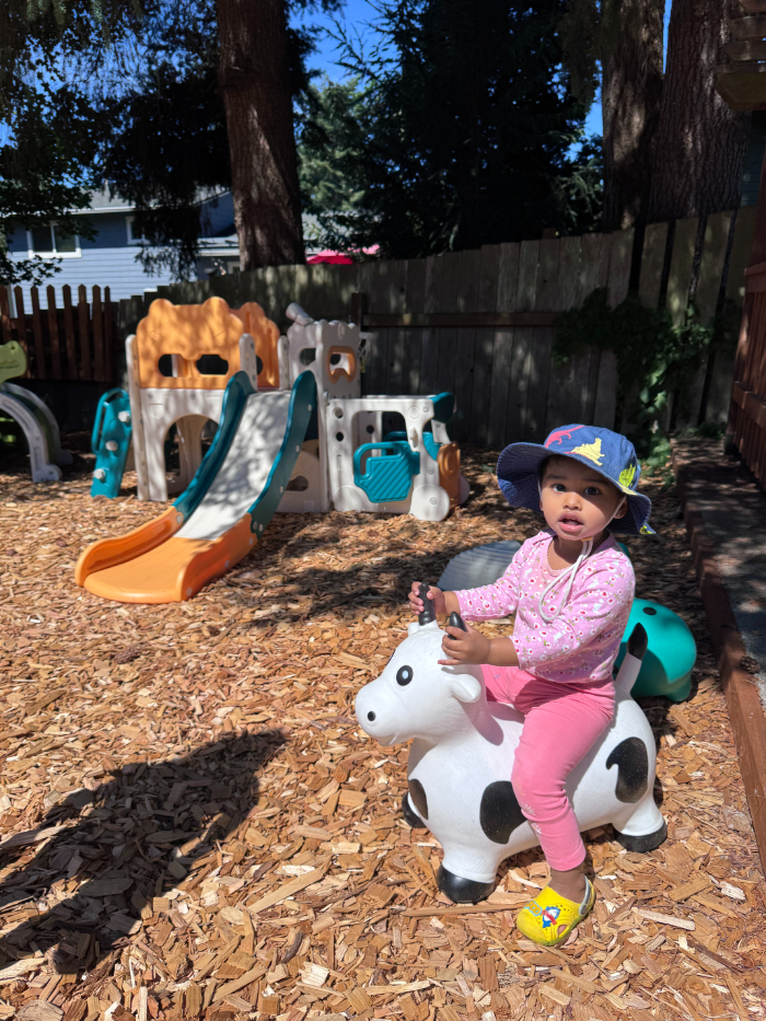 Infant sensory play with natural materials at nature-based camp