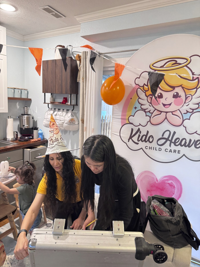 caregiver interacting with children in development-focused daycare