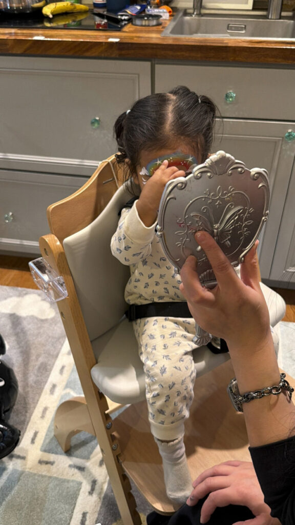hy toddler observing group play in a Bothell daycare classroom