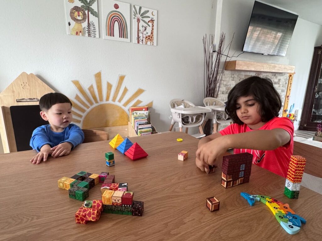 Children building with blocks in a play-based classroom