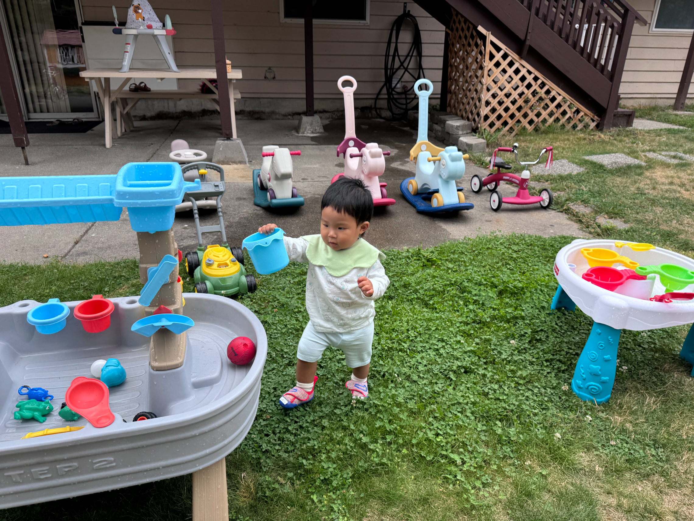 Children collaborating in outdoor water play activity