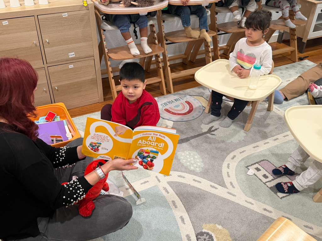 Teacher guiding small group circle time discussion