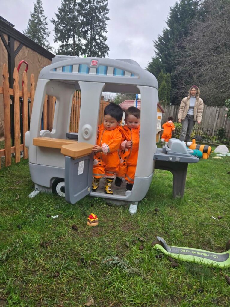 Outdoor gross motor play in childcare center
