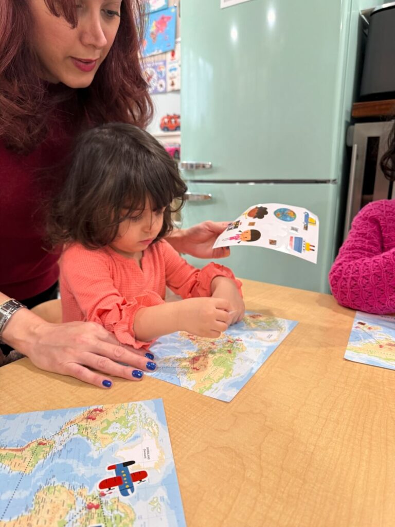 Toddler practicing a skill with caregiver guidance