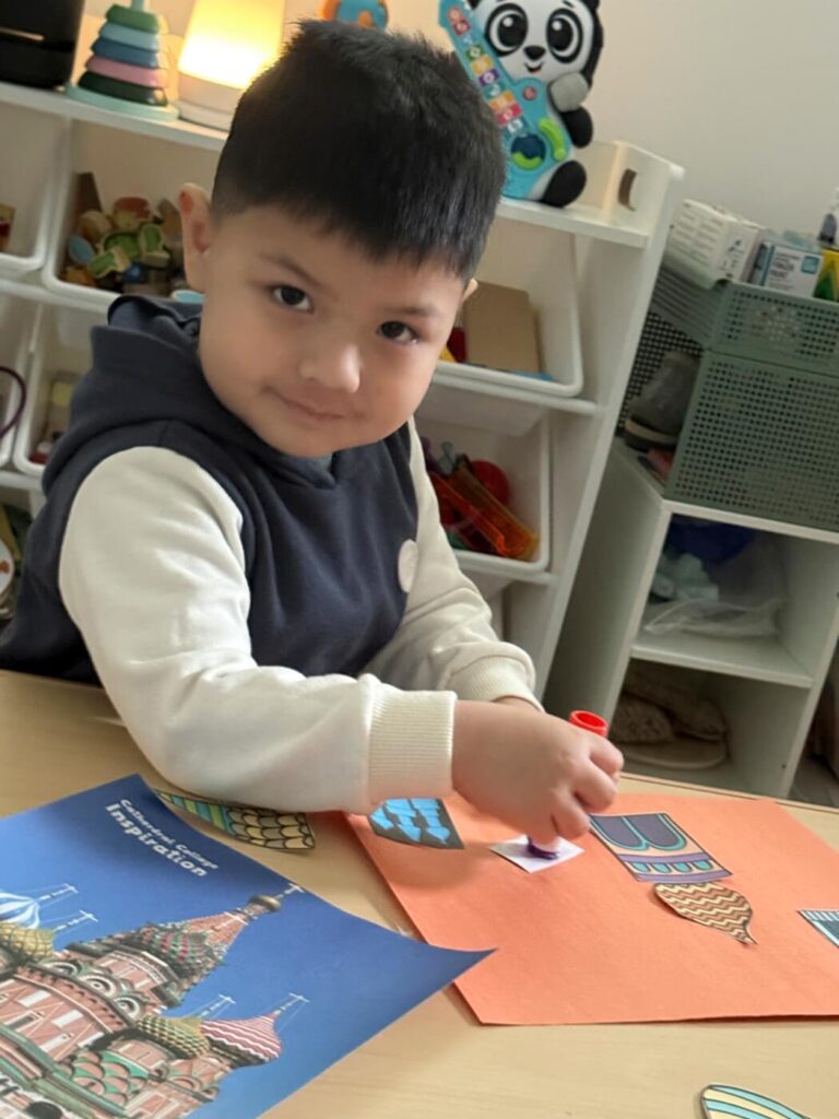 Child repeating a learning activity in daycare