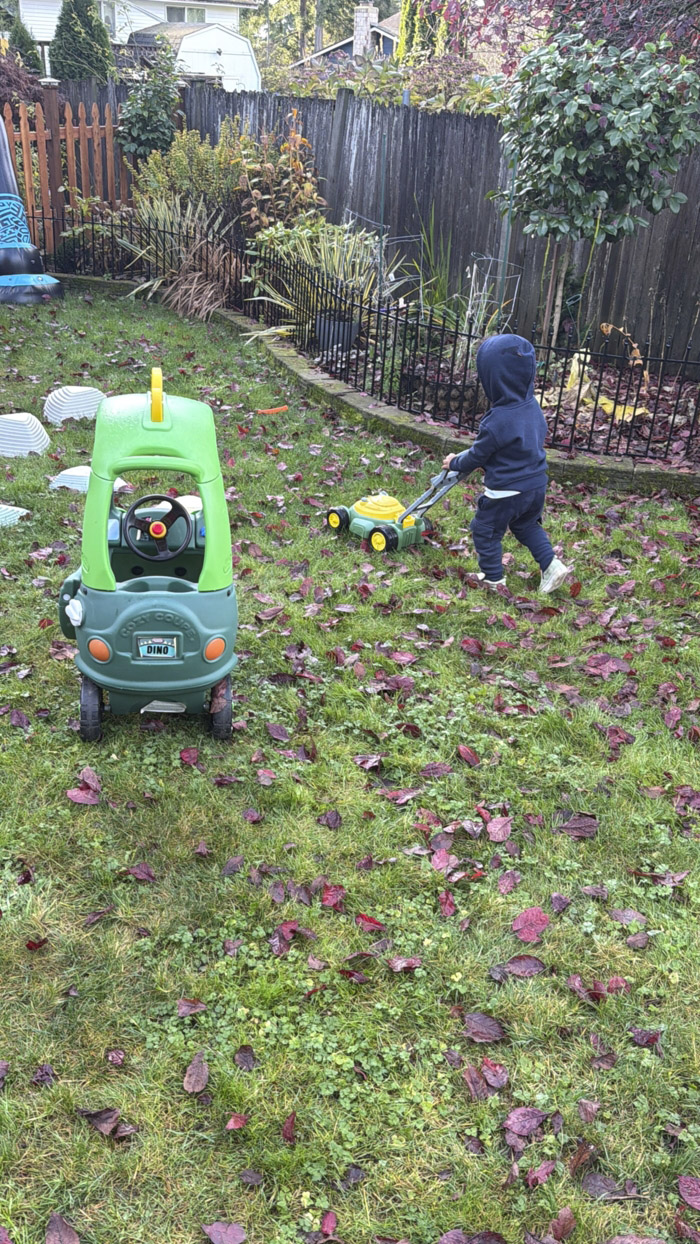 preschool children cleaning play area together
